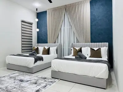 two beds in a bedroom with blue walls at MSprivate Pool-Ipoh Perak in Ipoh