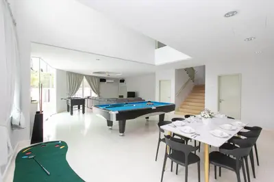 a dining room with a pool table and ping pong ball at GeorgeTown Codrington 6BR KTV BBQ Pool Bungalow 28Pax in George Town
