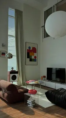 a living room with a couch and a television at Haus in George Town
