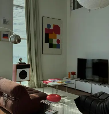 a living room with a couch and a tv at Haus in George Town