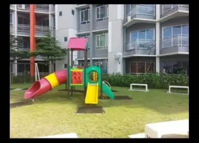 a playground in front of a large apartment building at Mikayla Homestay in Ipoh