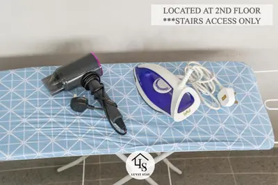 a table with a hair dryer and a hairdryer at IPOH CAIP TownHouse UpperUnit 4R3B Ipoh Tambun 10Pax by Luvit Stay in Ipoh