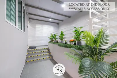 a hallway with plants on a stair case at IPOH CAIP TownHouse UpperUnit 4R3B Ipoh Tambun 10Pax by Luvit Stay in Ipoh