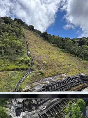a set of train tracks on a hill with trees at Ella Residence Homestay in Brinchang