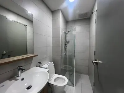 a bathroom with a shower and a toilet and a sink at Di Aran Residence Penang in Simpang Ampat