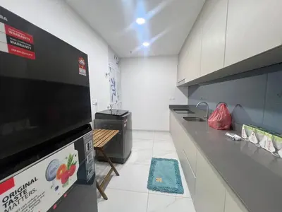 a kitchen with a stove and a counter top at Di Aran Residence Penang in Simpang Ampat