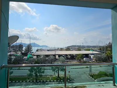 a view of a marina from a balcony at Marina Island Apartment, Lumut in Lumut