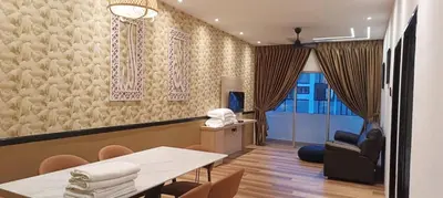 a waiting room with a table and a chair at Adik Aisyah goldblack homestay cameron highlands in Tanah Rata