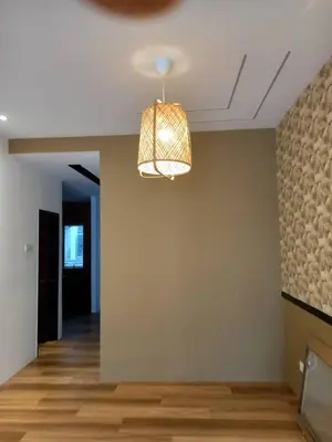 a room with a light hanging from a ceiling at Adik Aisyah goldblack homestay cameron highlands in Tanah Rata
