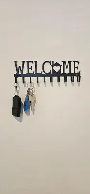 a bunch of keys hanging on a wall with the word welcome at Suria Aman Homestay Semi-D 5 Rooms 5 Bathrooms in Taiping