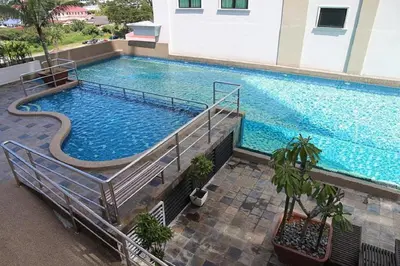 an overhead view of a large swimming pool in a building at Kinta Riverfront Apartment Ipoh, Fully Air-Con Suite IPOH in Ipoh