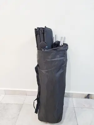 a black bag sitting on the floor next to a wall at IPOH Taman Pelangi Double Storey Homestay in Ipoh