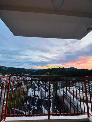 a balcony with a view of a parking lot at Daddy Homes3 Emerald Centrum Brinchang Cameron Highlands sunset view in Brinchang