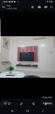 a picture of a living room with a tv on a wall at Crystal Creek condo Taiping in Taiping