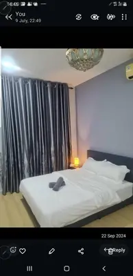 a picture of a bedroom with a white bed and a window at Crystal Creek condo Taiping in Taiping