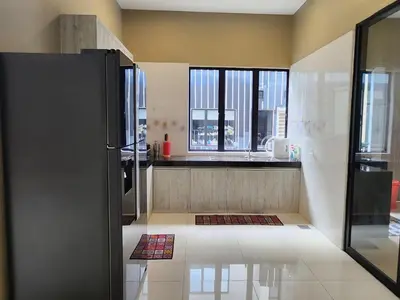 a kitchen with a refrigerator and some windows at Botani Nadya 5B4B by verve 19 pax in Ipoh