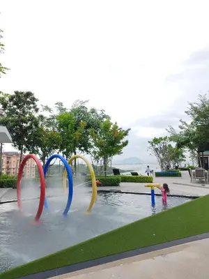 two children are playing in a water park at relax family stay 3BR 10pax urban in Jelutong