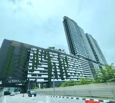 a large building with two tall buildings next to a street at relax family stay 3BR 10pax urban in Jelutong
