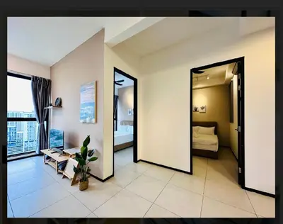 a large room with a bedroom with a bed and a mirror at relax family stay 3BR 10pax urban in Jelutong