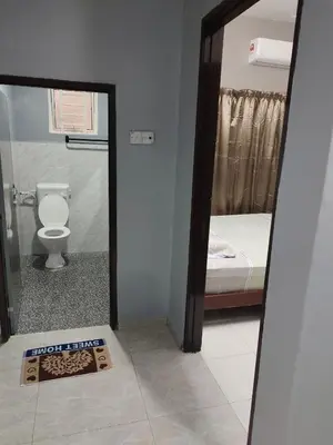a room with a bathroom with a toilet and a mirror at DeStay Taiping in Taiping