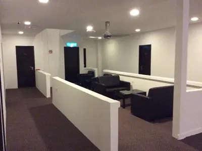 an office with a waiting room with chairs and tables at HOTEL RAUB since 1968 in Raub