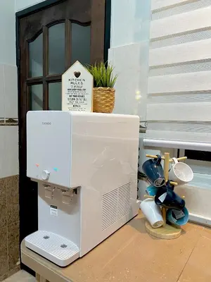 a microwave oven sitting on top of a table at Cozy Stay Bertam in Kepala Batas