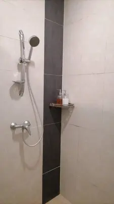 a shower with a shower head in a bathroom at Nova Highlands Hilltop Retreat Cameron Highlands in Brinchang