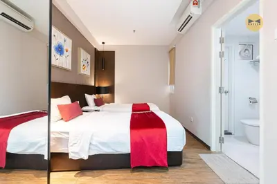a bedroom with a large bed and a bathroom at Seaview Seafront Duplex in Town with WiFi & Full Kitchen 23 in George Town
