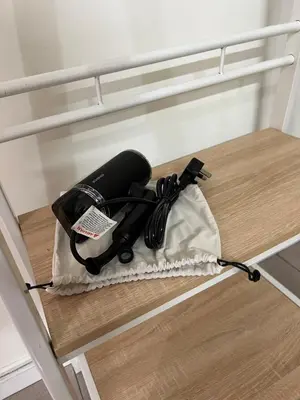 a blow dryer on the bottom of a bunk bed at Green at 62 in Ipoh