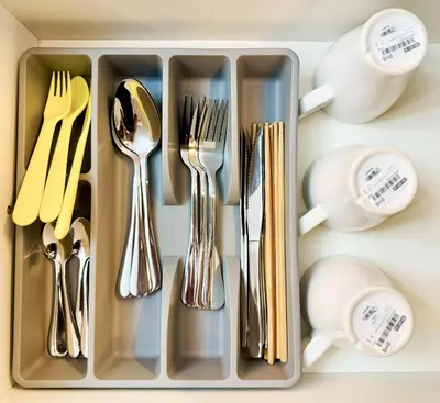 a tray filled with silver utensils on a counter at Georgetown near Gurney and Straits Quay Seaview with Netflix and Washer Dryer in George Town