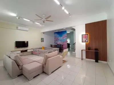 a living room with a couch and a flat screen tv at Cheerfull-Cozy Japanese Style in Bukit Mertajam