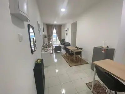 a living room with a table and a dining room at Anderson Residency Ipoh Wifi Pool Islam in Ipoh