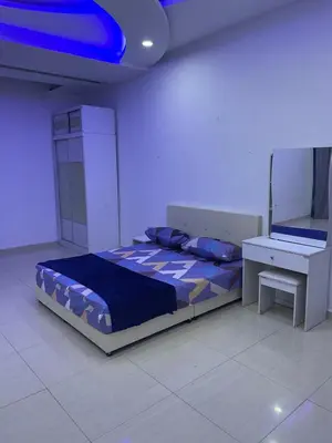 a bedroom with a bed and a mirror and a desk at 6 Rooms Budget 3 Tingkat USM Gelugor Georgetown in Gelugor