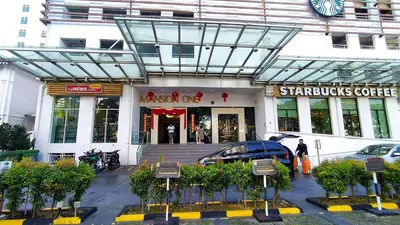 a store front of a building with cars parked outside at Mansion One 279 in George Town