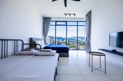 a bedroom with two beds and a large window at Beacon Suites #Georgetown #FamilyStay #13A #Cozy in George Town