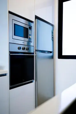 a microwave and a refrigerator in a kitchen at Beacon Suites #Georgetown #FamilyStay #13A #Cozy in George Town