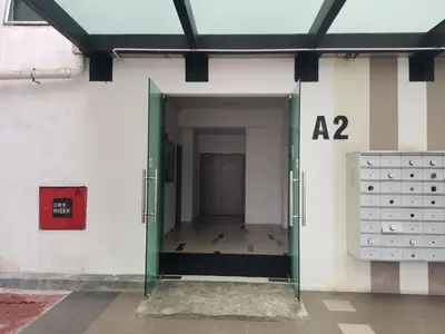 an open door to a room with a number on the wall at Ummus Homestay in Tanah Rata