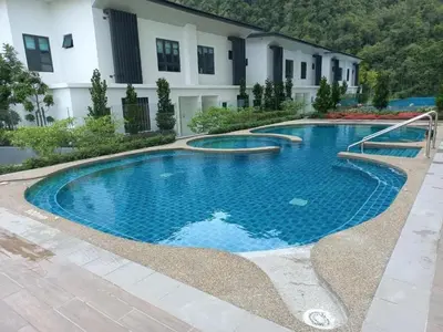 a large swimming pool in front of a building at ThemeParkview-Sunway Onsen-2br2b in Ipoh