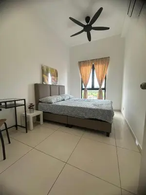 a bedroom with a bed and a ceiling fan at horizon ipoh in Ipoh