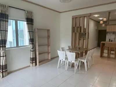 a dining room with a table and white chairs at Family Stay at Quintet A3A-3A-6 in Tanah Rata