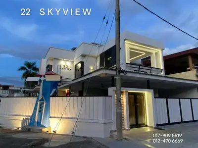 a white house with a blue staircase in front of it at 22 Skyview in Bukit Mertajam