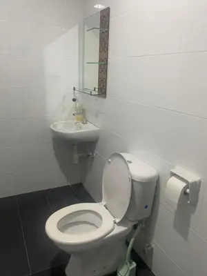 a bathroom with a white toilet and a sink at Ipoh town The Majestic Rumi 3R2B 8 paxs in Ipoh