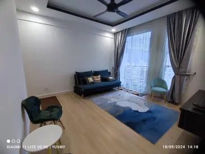 a living room with a black couch and a blue rug at 3 Bedroom Apartment YuCasa Sg Nibong Penang in Bayan Lepas