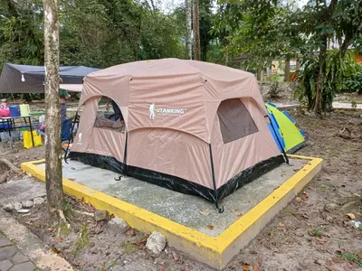 a tent is set up on a yellow ramp at Camp Site in Tapah