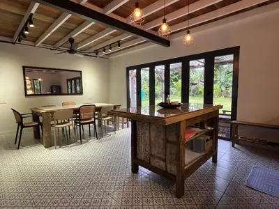 a dining room with a table and chairs in it at Villa Aman in Georgetown in George Town