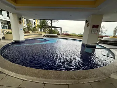 a large pool in the middle of a building at The Majestic Ipoh 3R2B SLY Home Twin City view unit in Ipoh