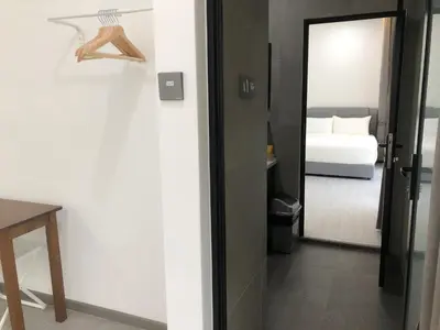 a door leading to a bedroom with a bed at BigLanded House NR Penang Hill & Kek Lok Si Temple in Ayer Itam
