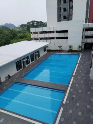 an image of a swimming pool in a building at ANAS Homestay in Ipoh