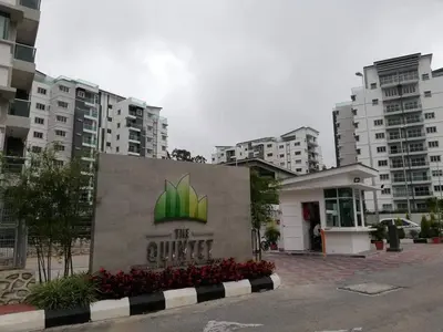 a building with a sign in front of some buildings at AYAAN QUINTET FAMILY HoMESTAY Free Parking in Tanah Rata