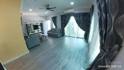 a living room with a couch and a tv at Ss homestay in Seri Manjung
